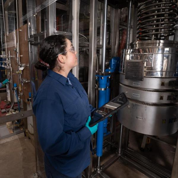 Scientist looking at a machine