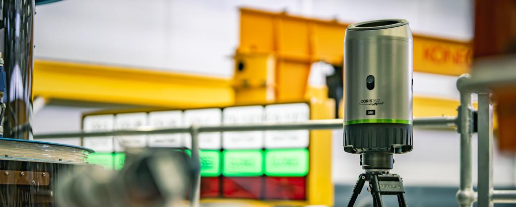 CORIS360 Gamma Neutron Imager unit on tripod in industry setting