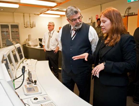 Senator the Hon Kim Carr Min Innovation Industry Science and Research speaks with reactor operator Jasmin Craufurd Hill 2009