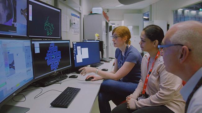 Scientists in instrument cabin Australian Synchrotron