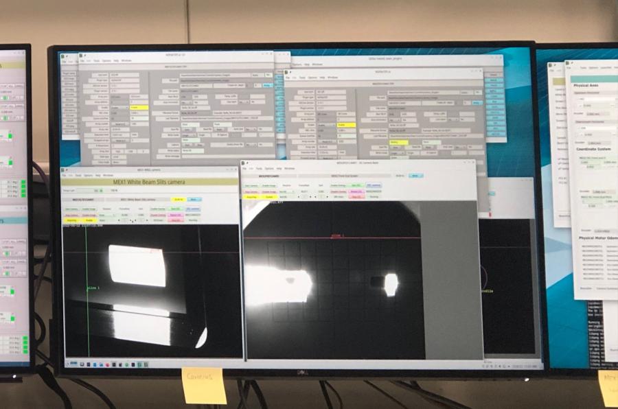 MEX user cabin monitor showing first light on the front end mask (right) and MEX1 white beam slits (left).