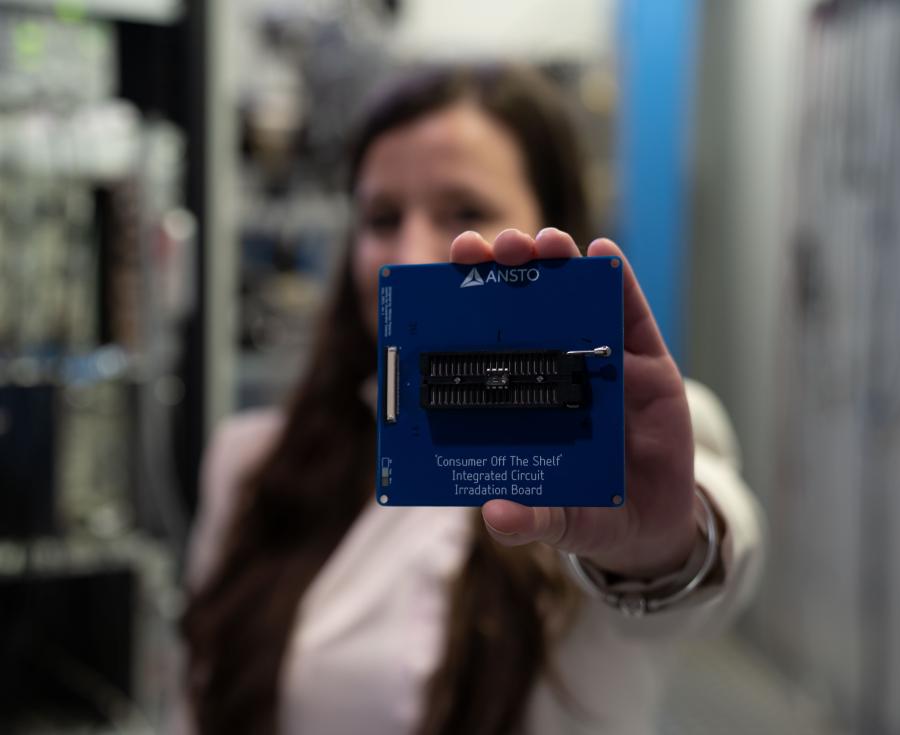 Stefania holding space testing IC board